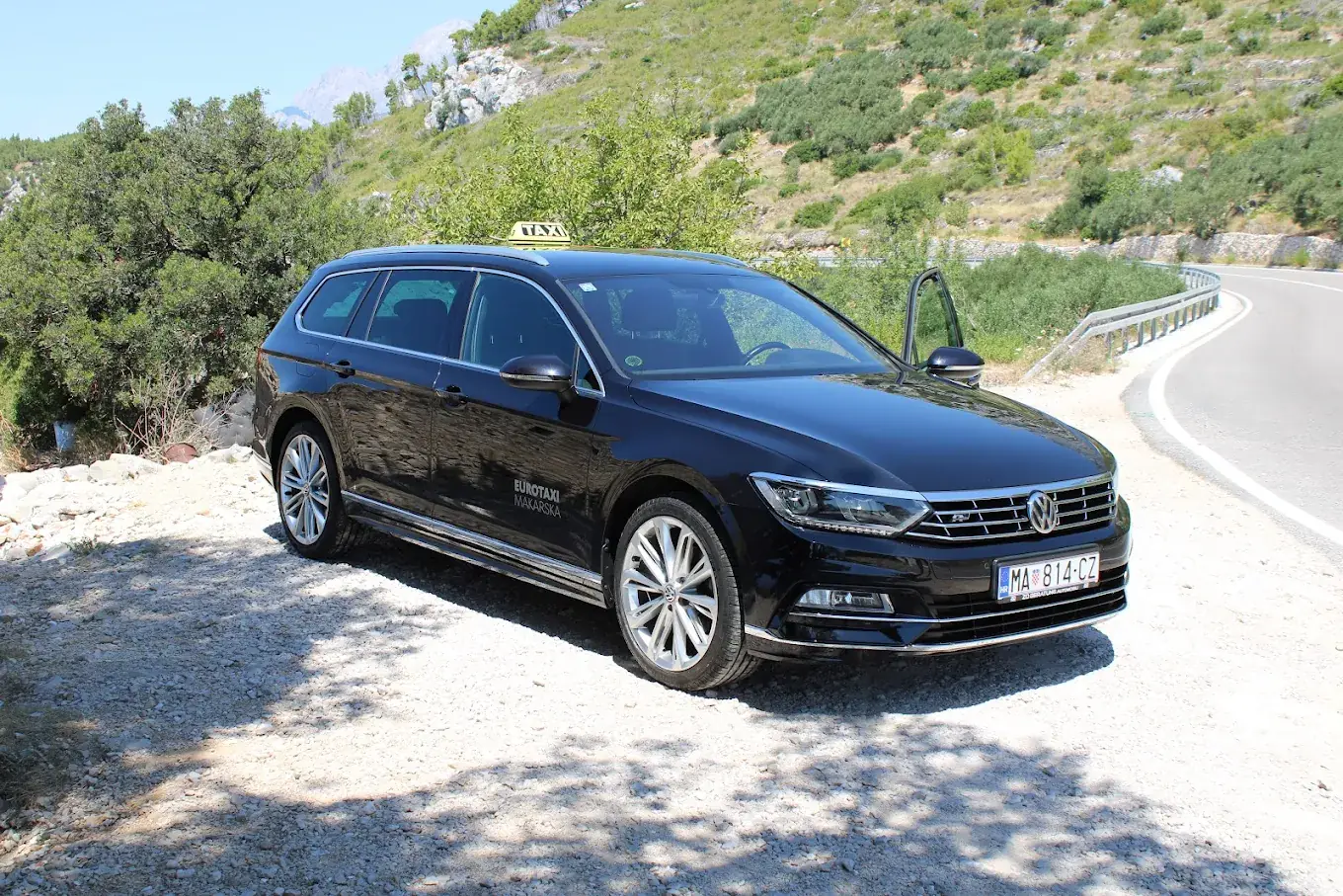 Eurotaxi Makarska vehicle parked beside a coastal road, front view