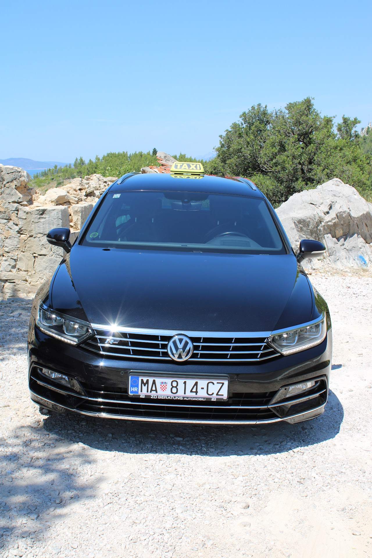 Front of the Eurotaxi Makarska vehicle with a yellow taxi sign